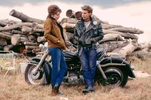 Jodie Comer (L) plays wife Kathy to biker Benny (Austin Butler, R) in the late 1960s setting of The Bikeriders. Photo: Focus Features